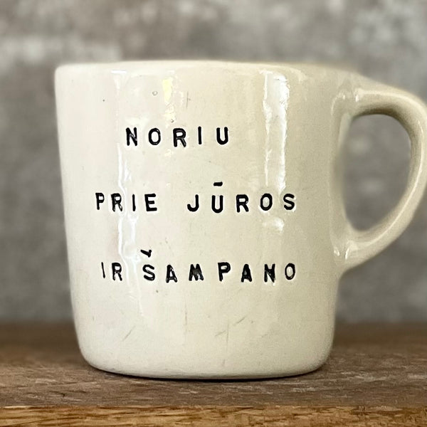 Small mug with words in Lithuanian