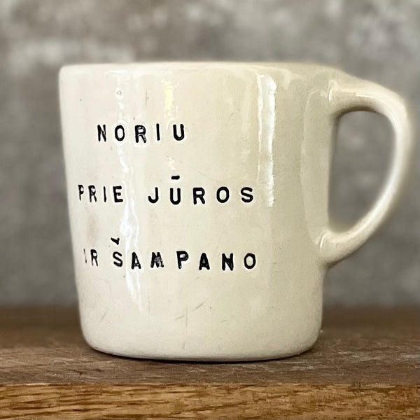 Small mug with words in Lithuanian