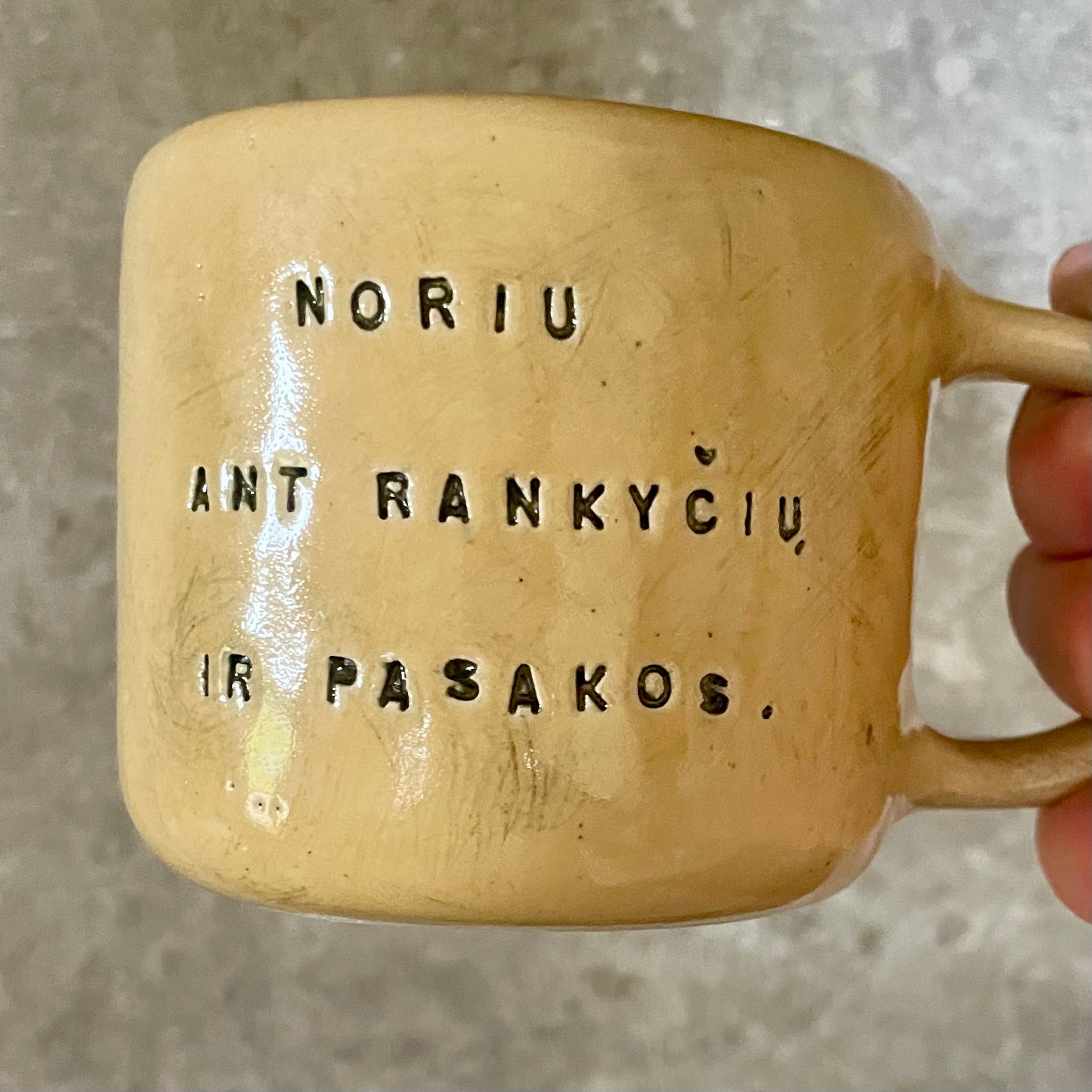 Yellow mug with sweet words in Lithuanian