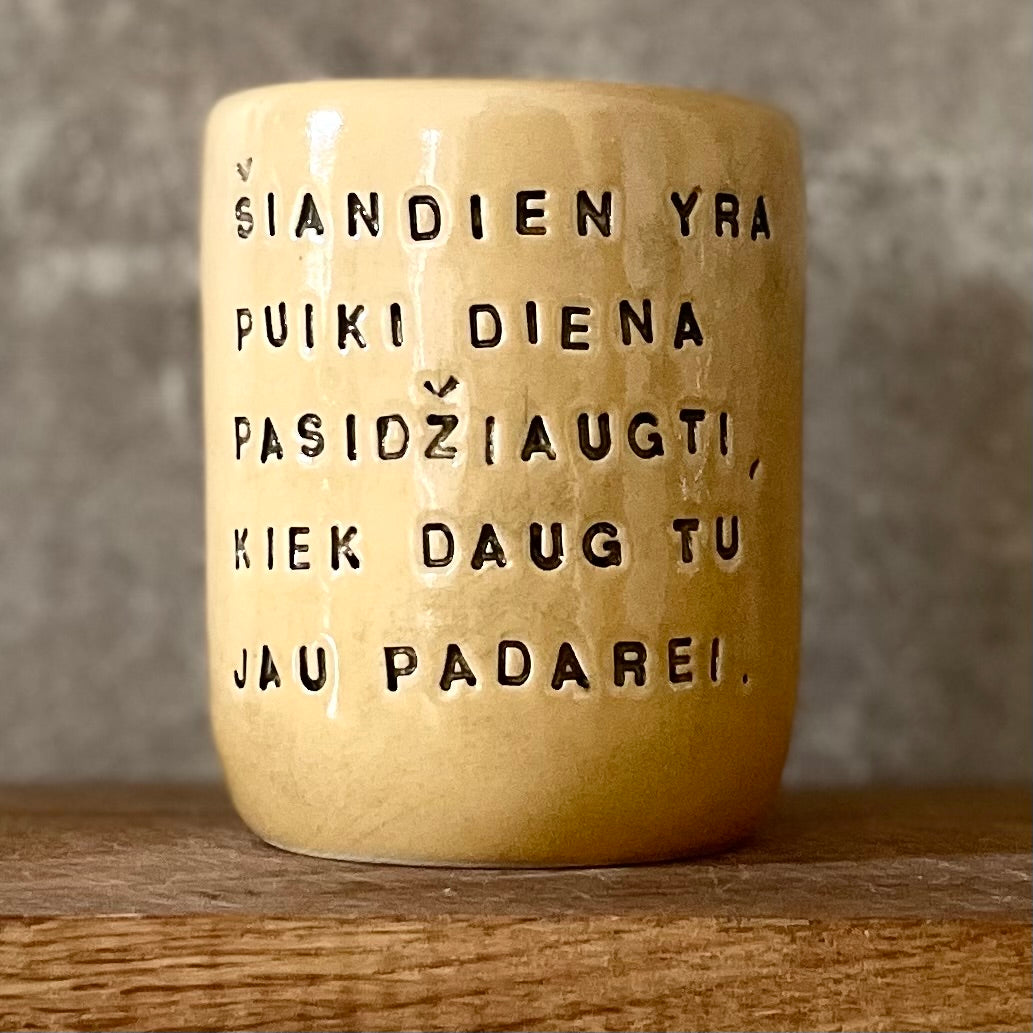 Yellow mug with optimistic text