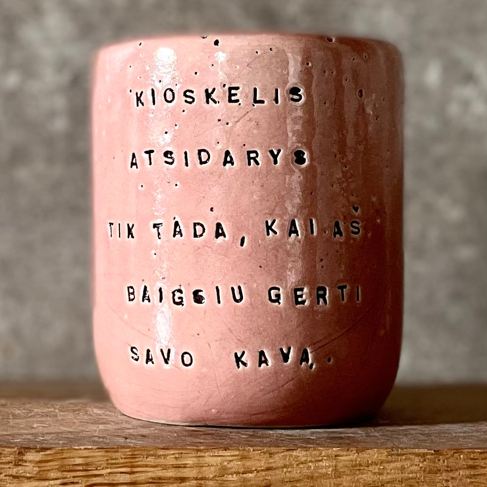 Pink mug with words in Lithuanian