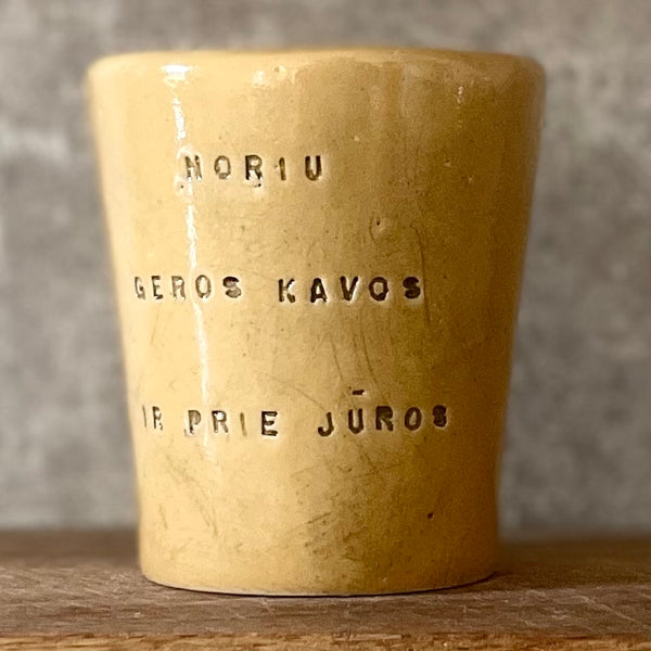 Yellow mug with phrase