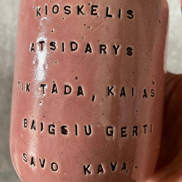 Pink mug with words in Lithuanian