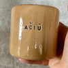 Handmade mug with word AČIŪ