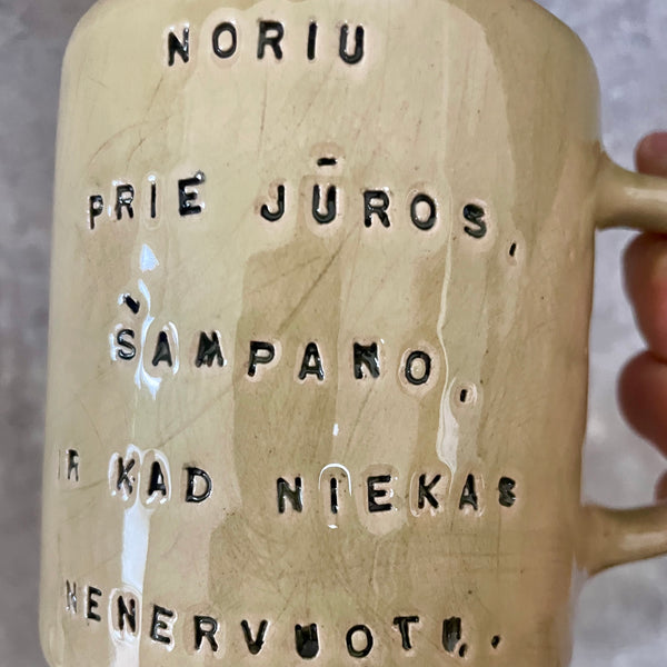 Cozy greenish mug with saying in Lithuanian