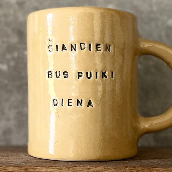 Ultra large yellow mug with text in Lithuanian