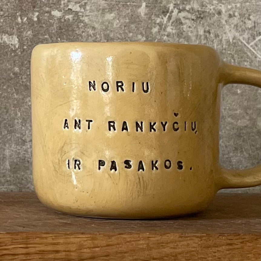 Yellow mug with sweet words in Lithuanian