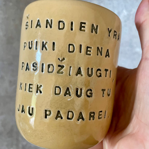 Yellow mug with optimistic text