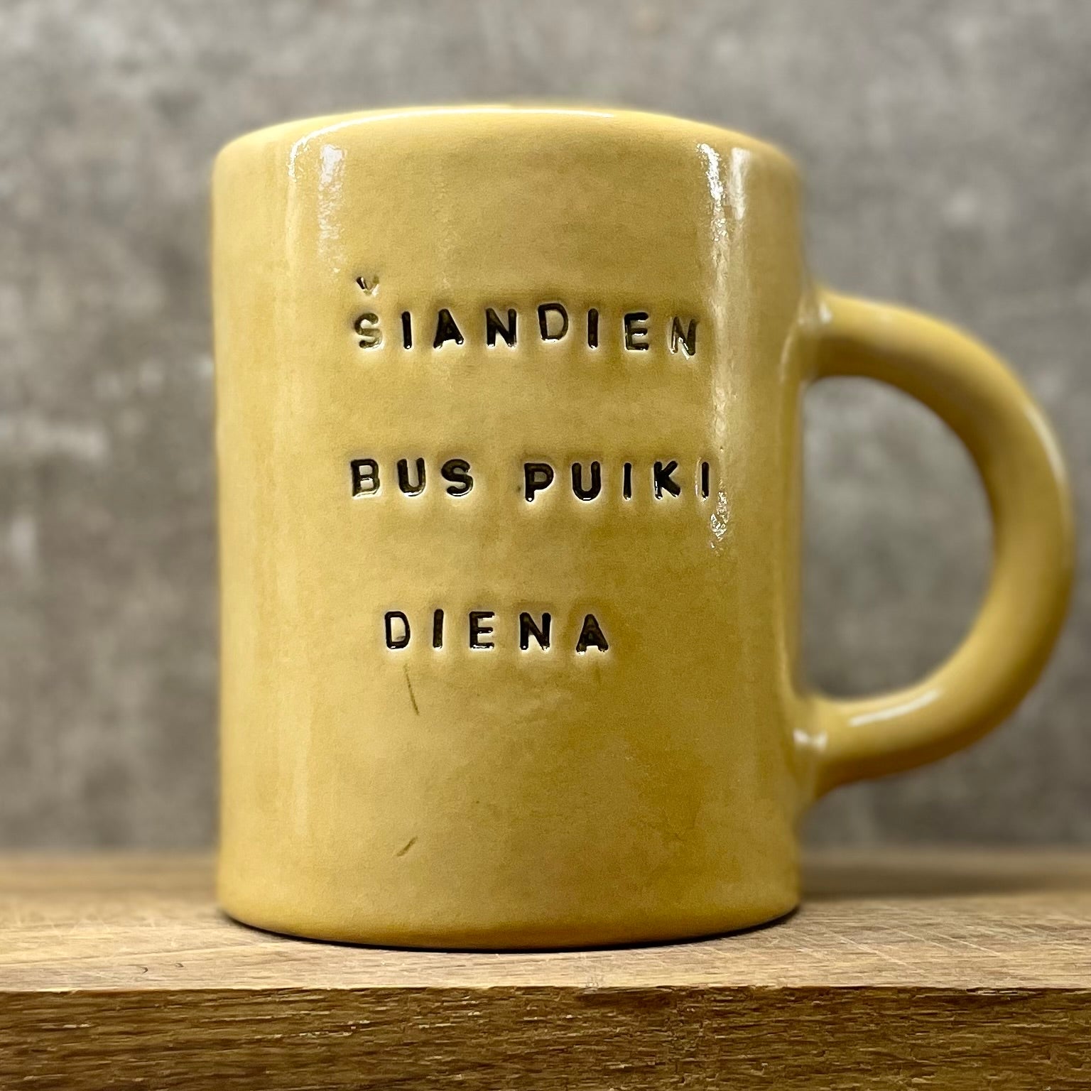 Ultra large yellow mug with text in Lithuanian