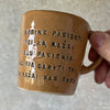 Golden yellow mug with inspirational phrase in Lithuanian